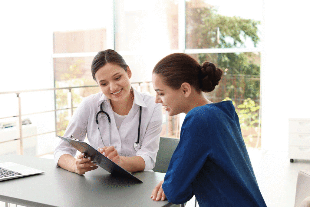 Doctor and nurse reviewing a medical document together.